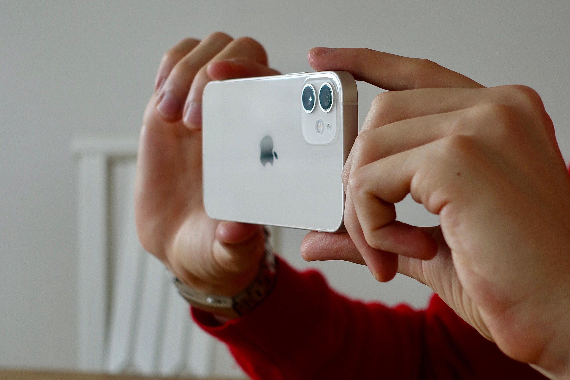 iPhone 12 in blue color on a flat surface